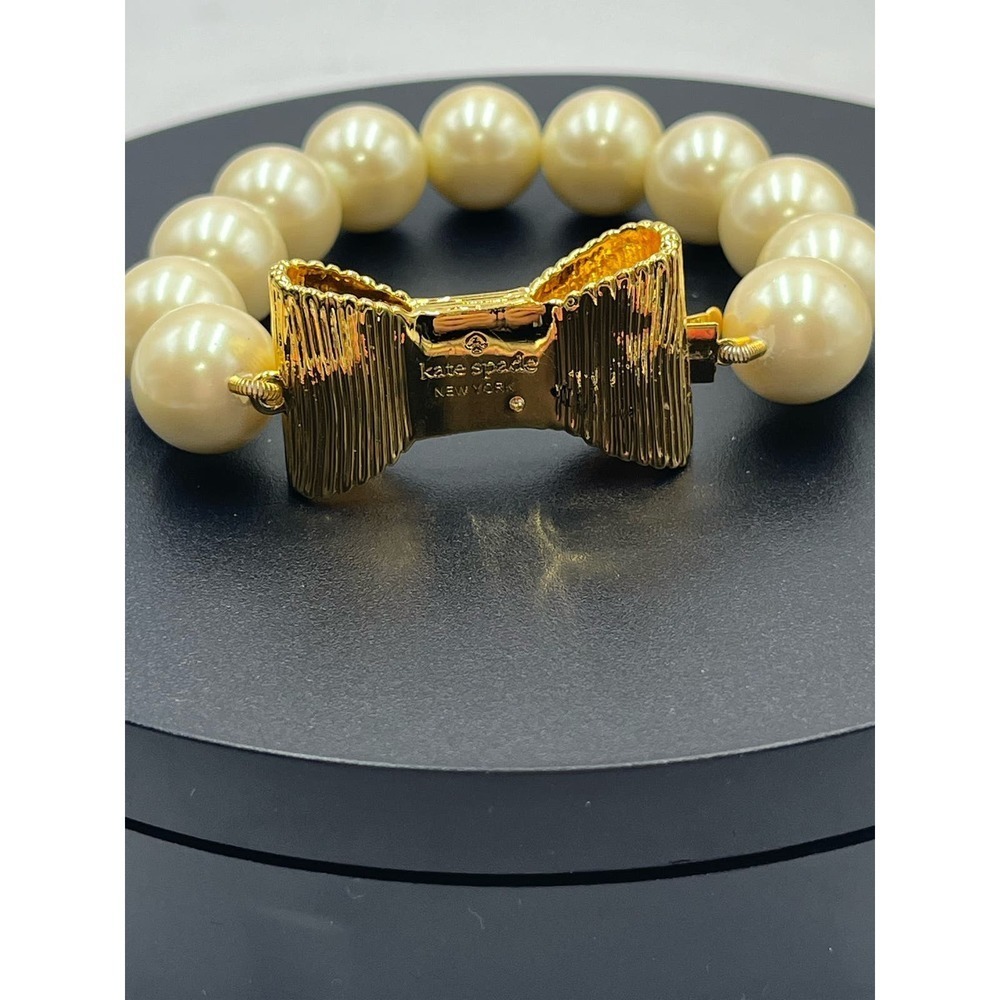 Kate Spade All Wrapped Up Pearl Gold Bow Bracelet - Picture 5 of 13